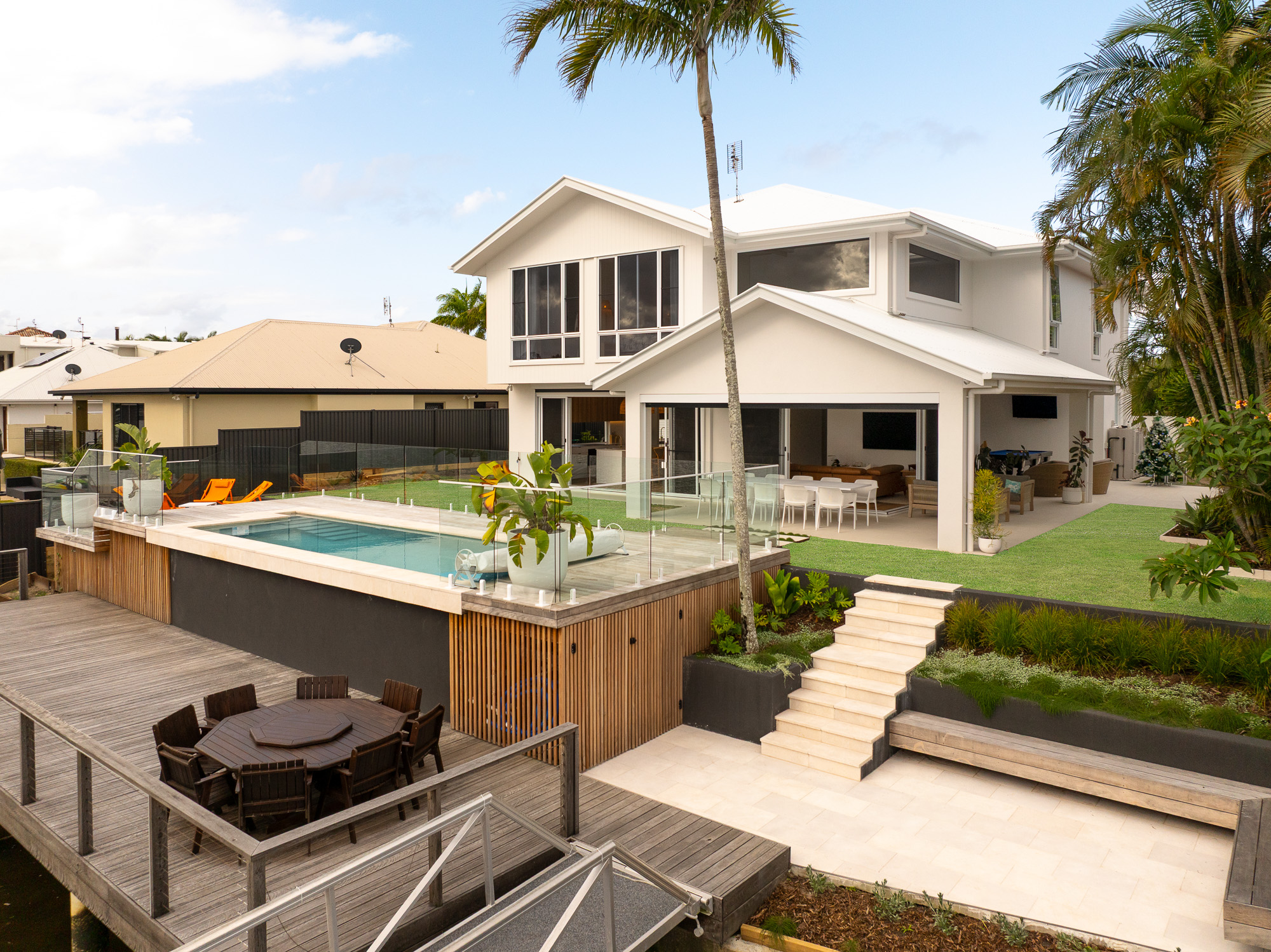 Waverly meadan queensland minyama coastal facade water pool entertaining design build coastal custom home queensland