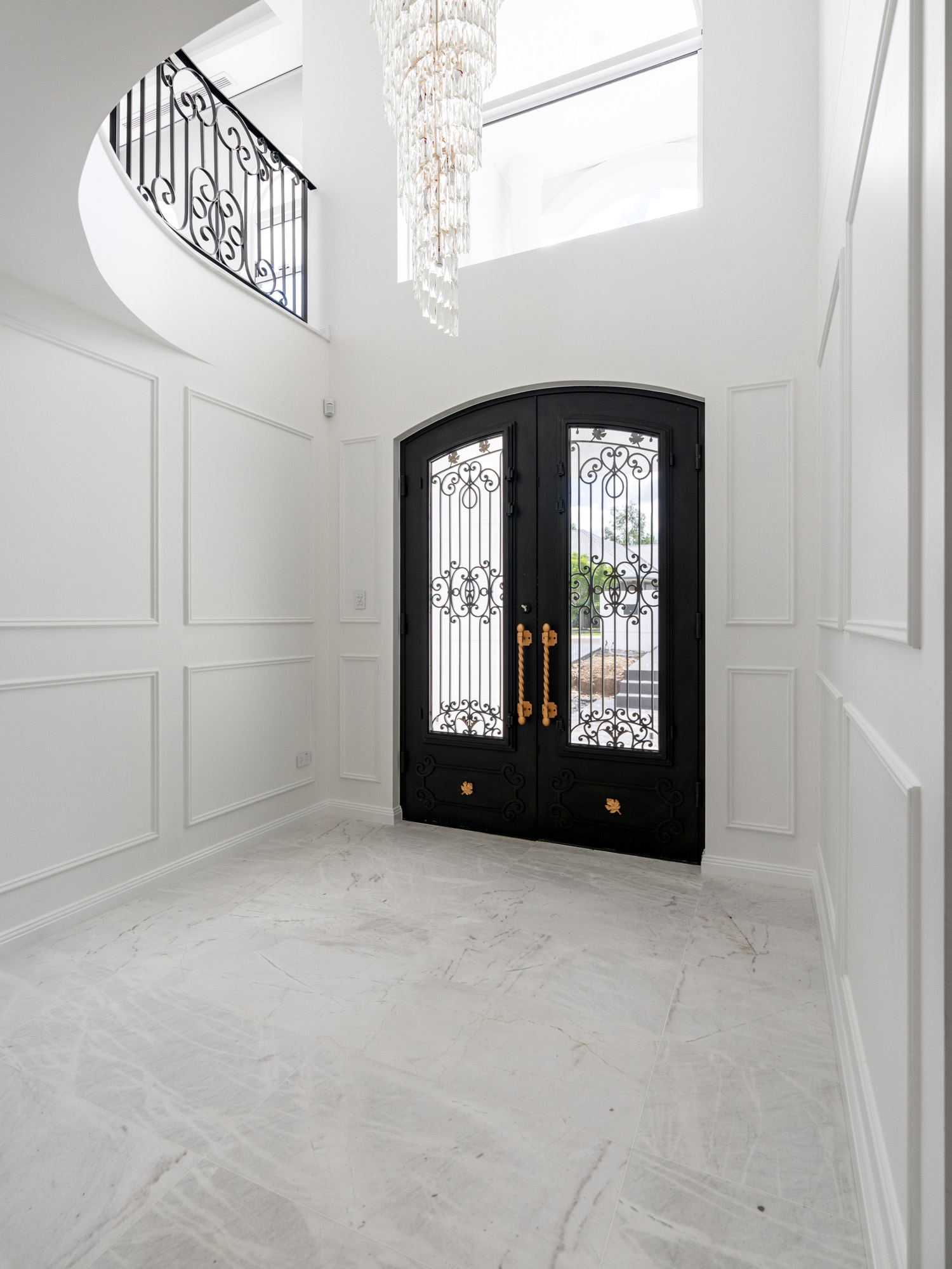 Wrought iron staircase entry foyer